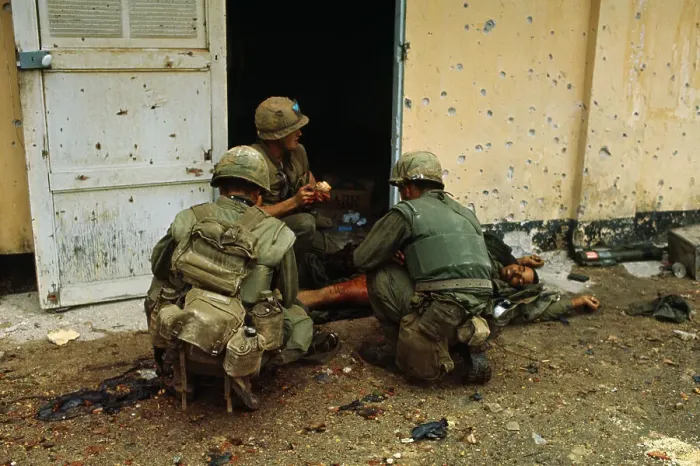 Framed Print : Marines Treating a Friend's Bullet Wound