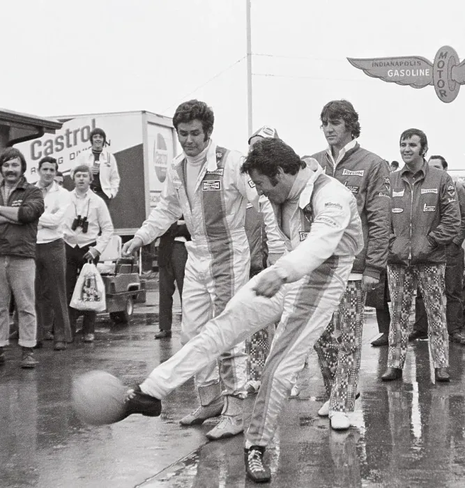 Framed Print : Mario Andretti Kicking Soccer Ball