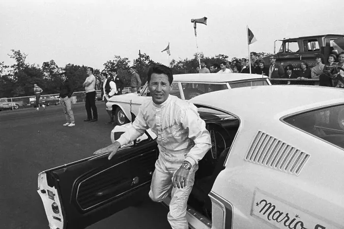 Framed Print : Mario Andretti Leaving Race Car Framed Print : Mario Andretti Leaving Race Car