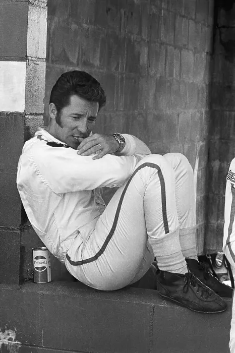 Framed Print : Mario Andretti Sitting in Crouched Position