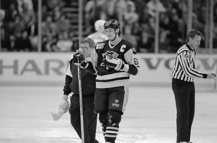 Framed Print : Mario Lemieux Leaving Hockey Court with His Trainer Framed Print : Mario Lemieux Leaving Hockey Court with His Trainer