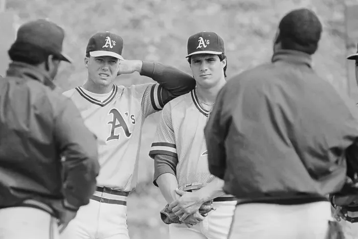 Framed Print : Mark McGwire and Jose Canseco Speaking with Coaches Framed Print : Mark McGwire and Jose Canseco Speaking with Coaches