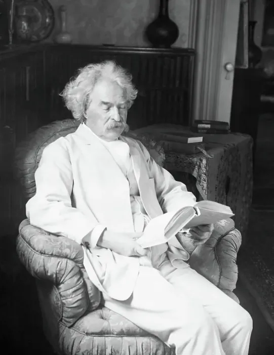 Framed Print : Mark Twain Reading A Book In Easy Chair Framed Print : Mark Twain Reading A Book In Easy Chair