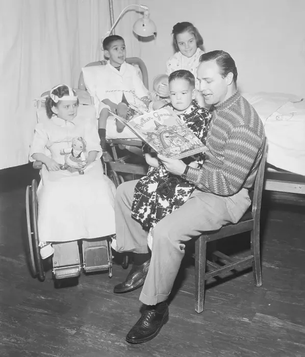 Framed Print : Marlon Brando Reading to Hospitalized Children Framed Print : Marlon Brando Reading to Hospitalized Children
