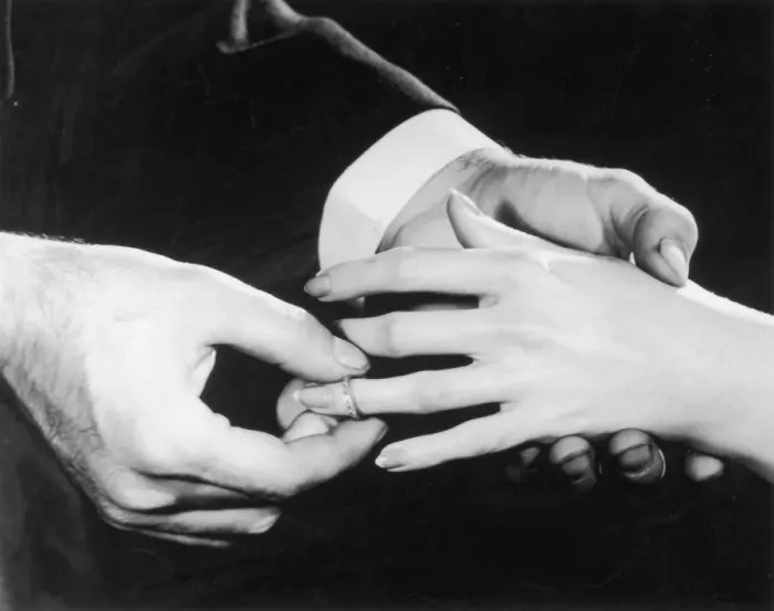 Framed Print : Marry Me. A man slips an engagement ring onto his fiancees finger, circa 1950 Framed Print : Marry Me. A man slips an engagement ring onto his fiancees finger, circa 1950