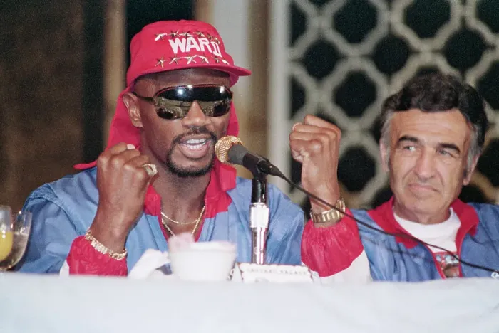 Framed Print : Marvin Hagler Holds Up Fists at Microphone Framed Print : Marvin Hagler Holds Up Fists at Microphone