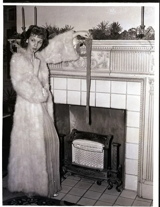Framed Print : Mary Martin Holding Up Stocking Framed Print : Mary Martin Holding Up Stocking