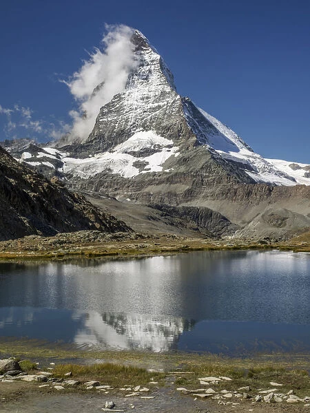 Matterhorn reflected in Riffelsee, Zermatt, Valais Canton, Switzerland