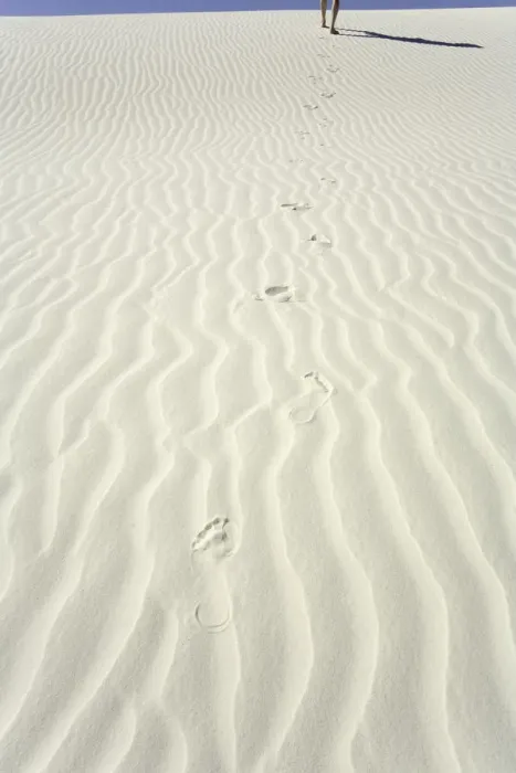 Framed Print : Mature man leaving footprints on white gypsum sand dune, low section