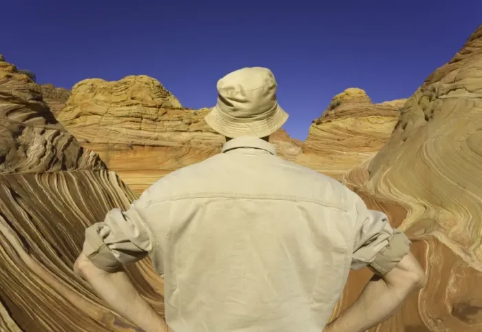 Framed Print : Mature man looking at sandstone buttes, rear view Framed Print : Mature man looking at sandstone buttes, rear view