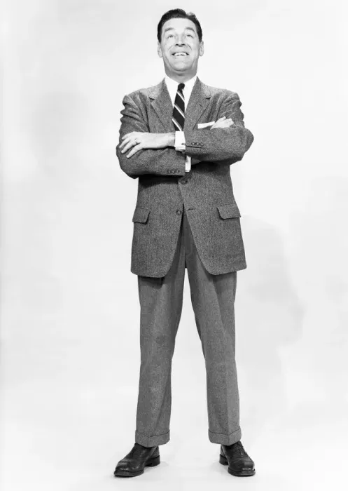 Framed Print : Mature man wearing suit, standing in studio, portrait
