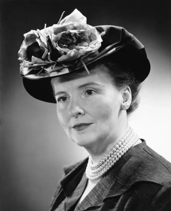Framed Print : Mature woman in flowered hat posing in studio, (B&W), (Close-up), (Portrait) Framed Print : Mature woman in flowered hat posing in studio, (B&W), (Close-up), (Portrait)