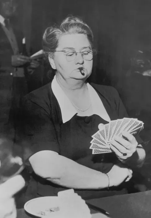 Framed Print : Mature woman playing cards, smoking cigar (B&W) Framed Print : Mature woman playing cards, smoking cigar (B&W)