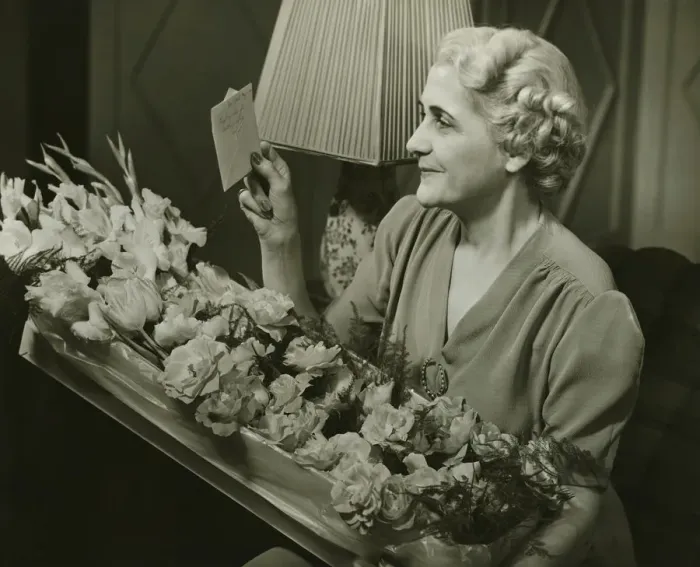 Framed Print : Mature woman receiving box of flowers, (B&W)