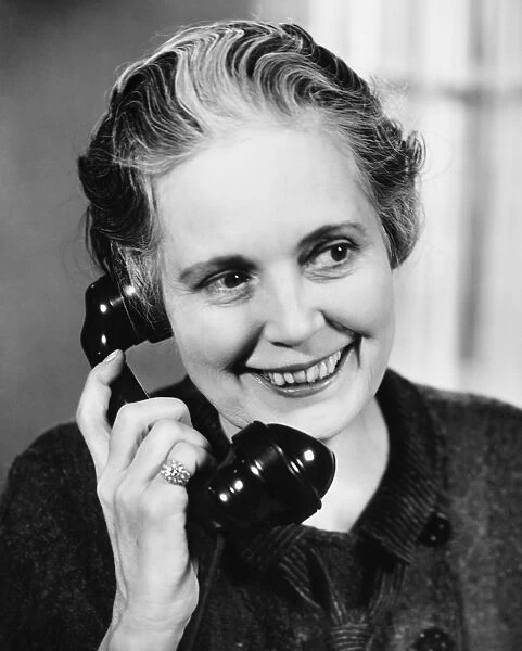 Mature woman talking on phone (B&W)
