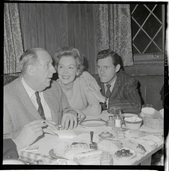 Framed Print : Maureen O'Sullivan Sitting at Table with Admirers Framed Print : Maureen O'Sullivan Sitting at Table with Admirers