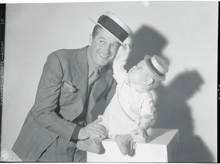 Framed Print : Maurice Chevalier and Baby Framed Print : Maurice Chevalier and Baby
