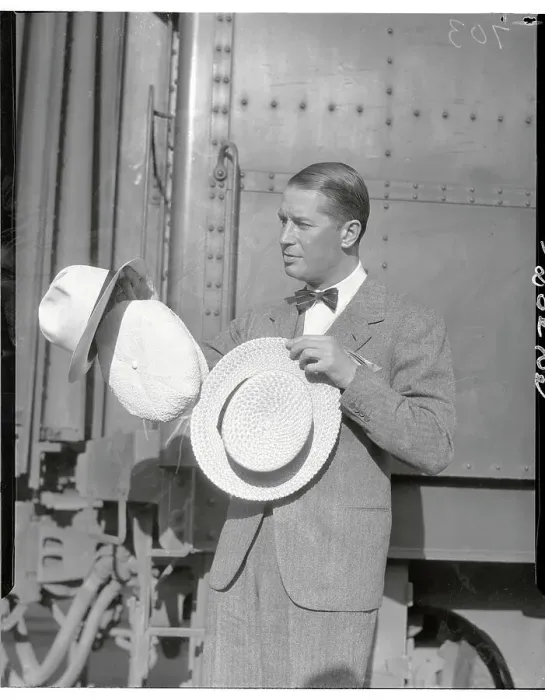 Framed Print : Maurice Chevalier Posing with Hats by Train Car