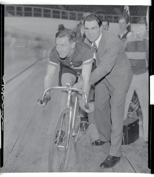Framed Print : Max Schmeling Assisting Bike Rider Framed Print : Max Schmeling Assisting Bike Rider