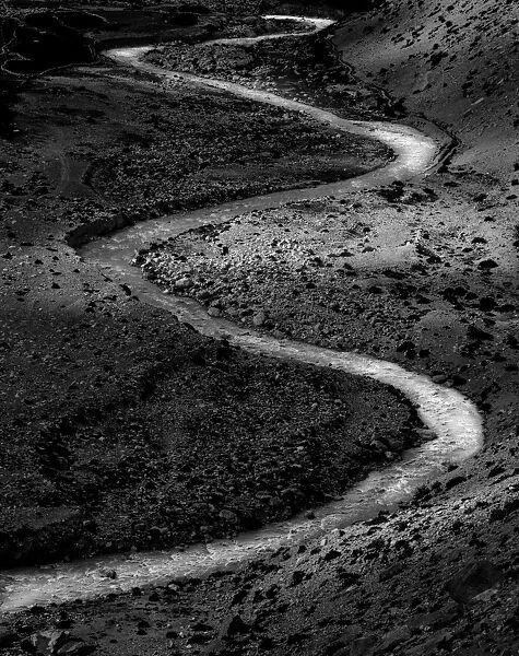 Meandering small creek in black and white