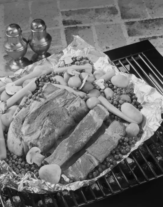 Framed Print : Meat with vegetables in tray on barbecue grill, close-up