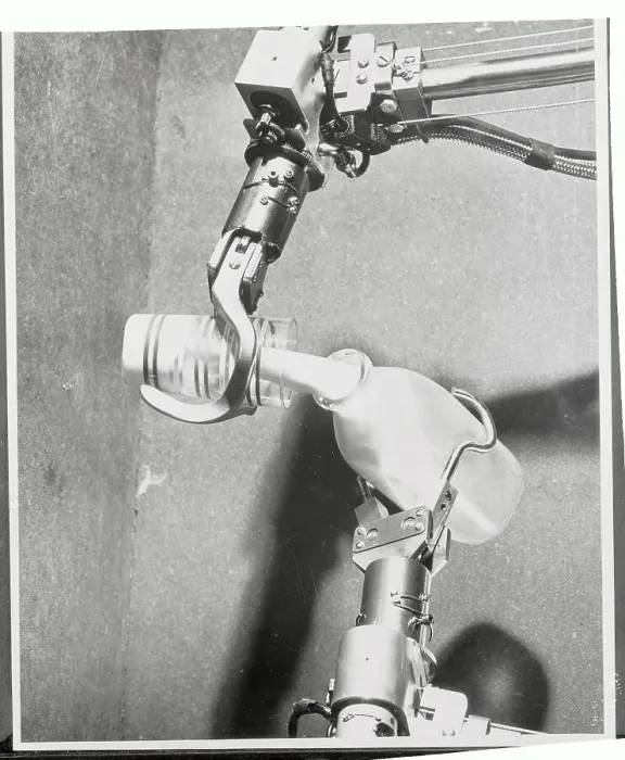 Framed Print : Mechanical Hands Pouring Milk From a Bottle