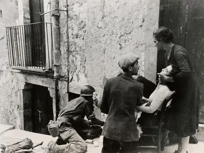 Framed Print : US Medic Treating Italian Woman Framed Print : US Medic Treating Italian Woman