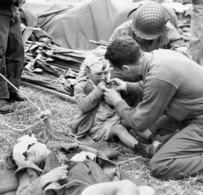 Framed Print : Medical Corpsman Gives Injured Child Candy Framed Print : Medical Corpsman Gives Injured Child Candy