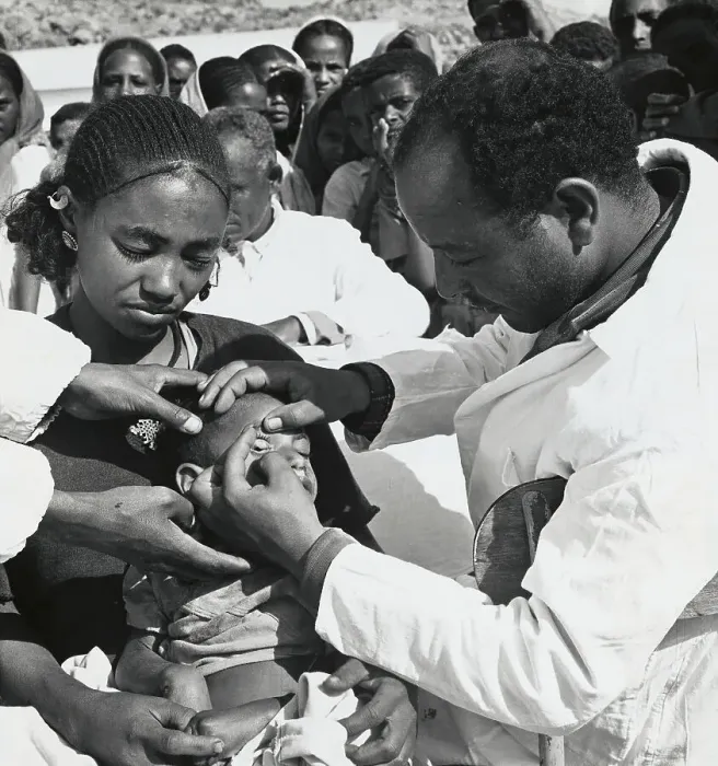 Framed Print : Medical Personnel Examining Young Child Framed Print : Medical Personnel Examining Young Child