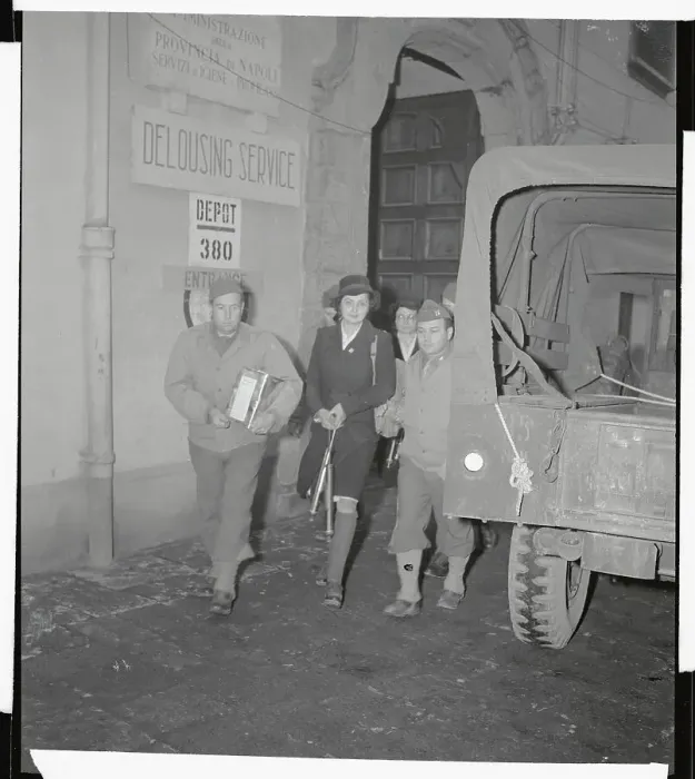 Framed Print : Medical Unit Members Walking Past Army Vehicle Framed Print : Medical Unit Members Walking Past Army Vehicle
