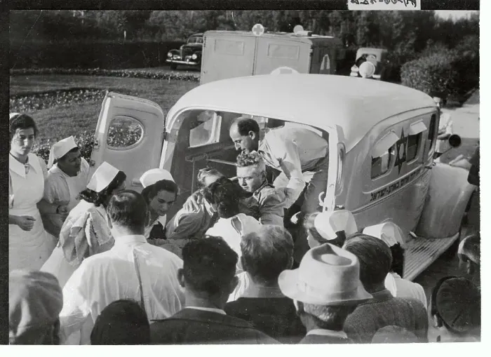 Framed Print : Medics Removing Wounded Man from Ambulance Framed Print : Medics Removing Wounded Man from Ambulance