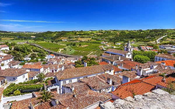 Medieval town with fortified walls and Santa Maria church, Obidos, Portugal