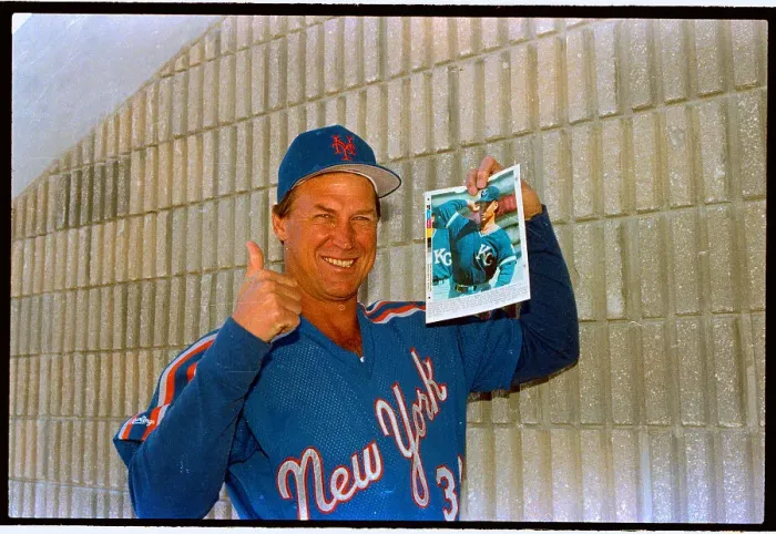 Framed Print : Mel Stottlemyre Showing off Picture of Son Framed Print : Mel Stottlemyre Showing off Picture of Son