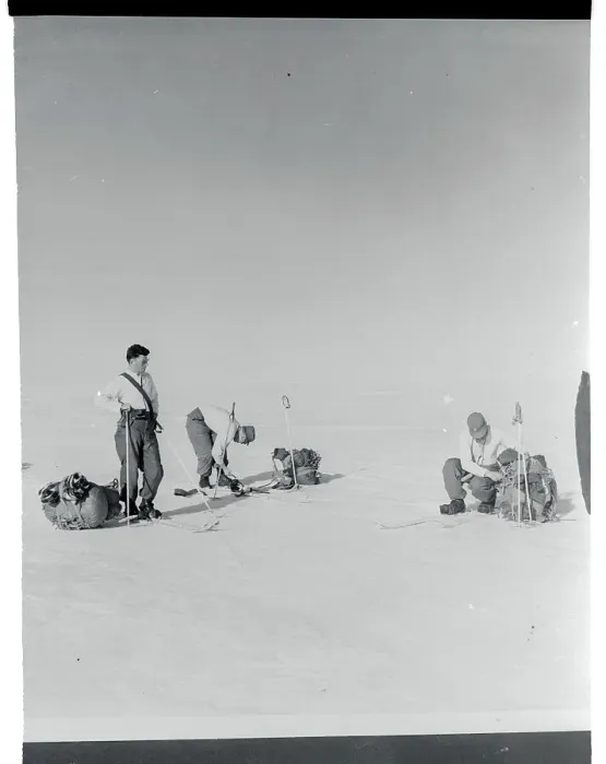 Framed Print : Men Adjusting Their Skis Framed Print : Men Adjusting Their Skis