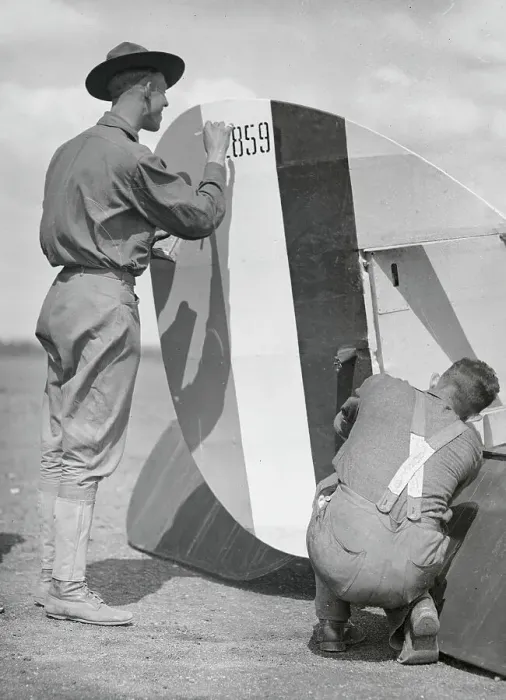 Framed Print : Men Attaching Rudder to Plane Framed Print : Men Attaching Rudder to Plane
