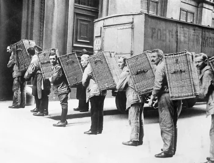 Framed Print : Men Carrying Baskets of Money Framed Print : Men Carrying Baskets of Money