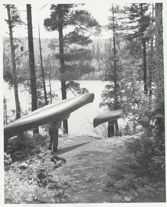 Framed Print : Men Carrying Canoes to River Framed Print : Men Carrying Canoes to River