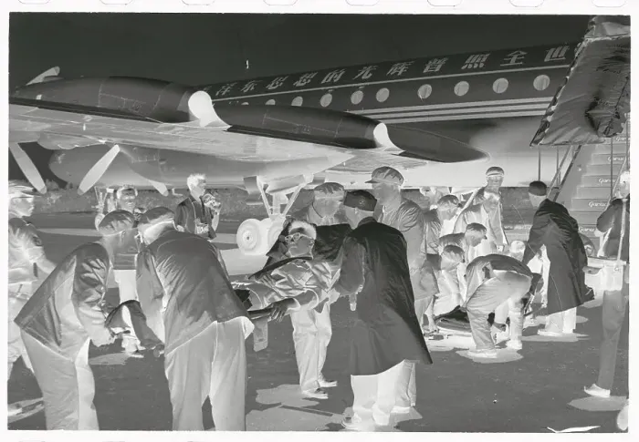Framed Print : Men Carrying Wounded Diplomats Towards Aircraft Framed Print : Men Carrying Wounded Diplomats Towards Aircraft