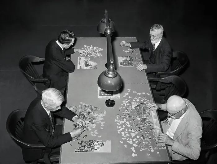 Framed Print : Men Concentrating on Jig-Saw Puzzles Framed Print : Men Concentrating on Jig-Saw Puzzles
