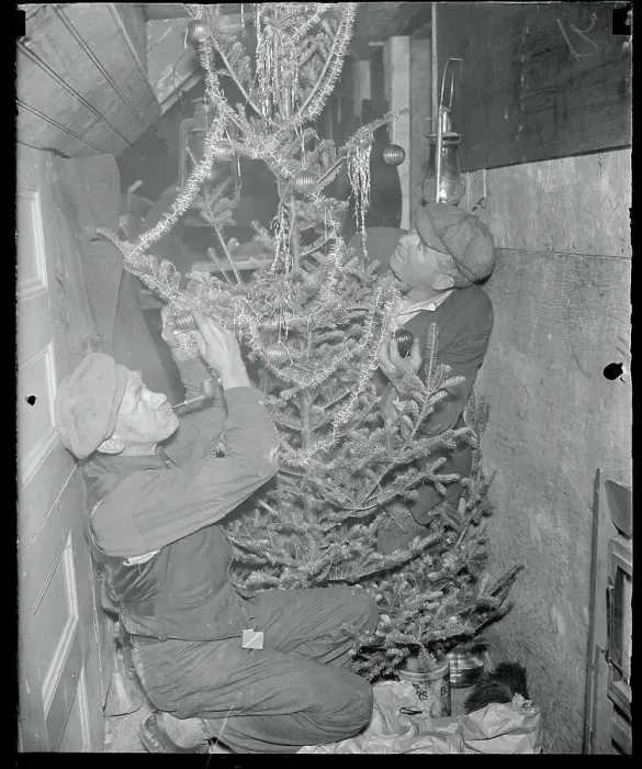 Framed Print : Men Decorating a Christmas Tree Framed Print : Men Decorating a Christmas Tree