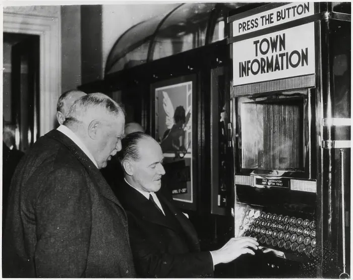 Framed Print : Men Demonstrating Automatic Info Machine Framed Print : Men Demonstrating Automatic Info Machine