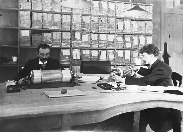 Framed Print : Men at Desks with Calculating Machines
