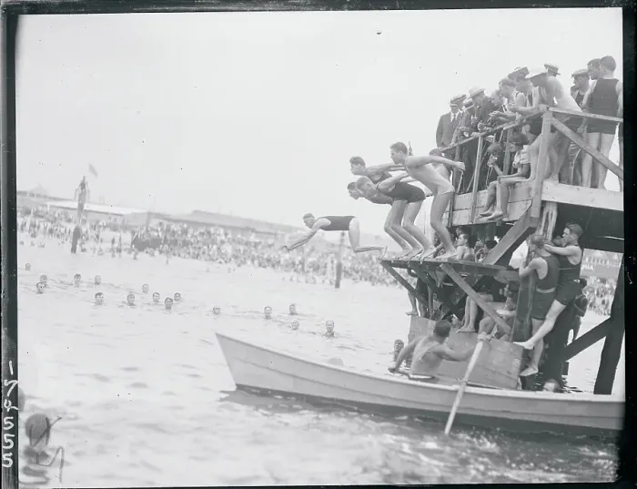 Framed Print : Men Diving Into Water