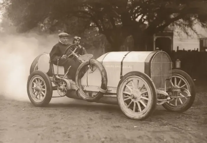 Framed Print : Two men driving race car (B&W sepia tone) Framed Print : Two men driving race car (B&W sepia tone)