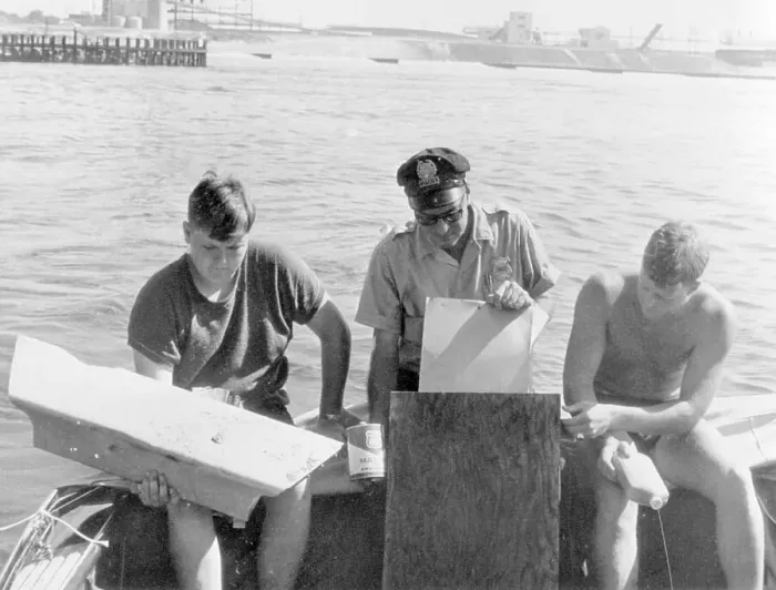 Framed Print : Men Examining Debris on Boat Framed Print : Men Examining Debris on Boat