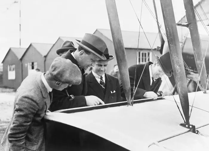 Framed Print : Men Examining Early Aircraft