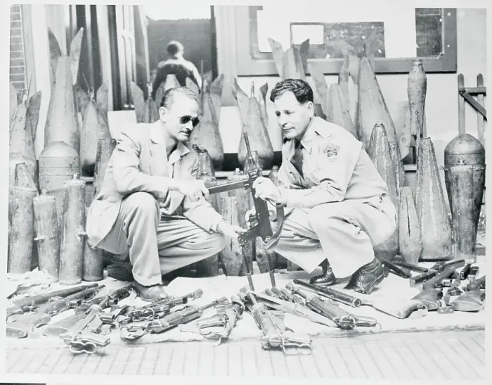 Framed Print : Men Examining Weapons Framed Print : Men Examining Weapons