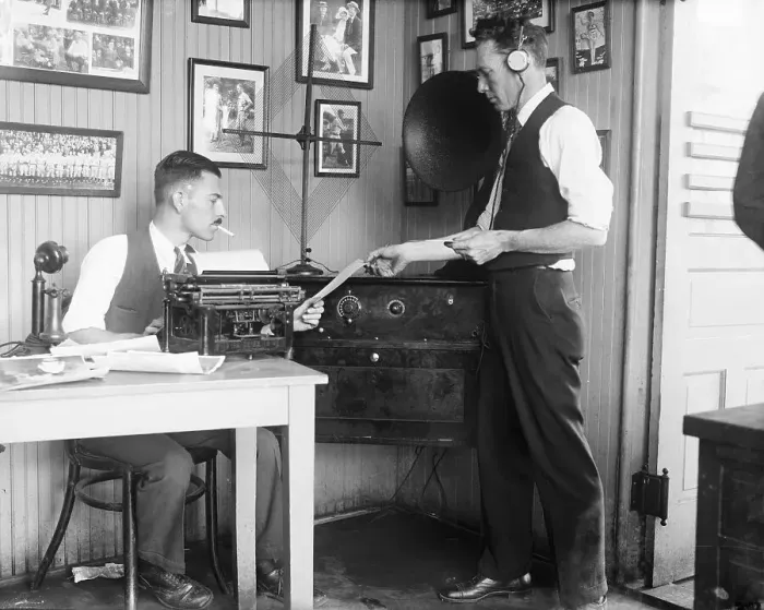 Framed Print : Two Men Exchanging Paper in Office Framed Print : Two Men Exchanging Paper in Office