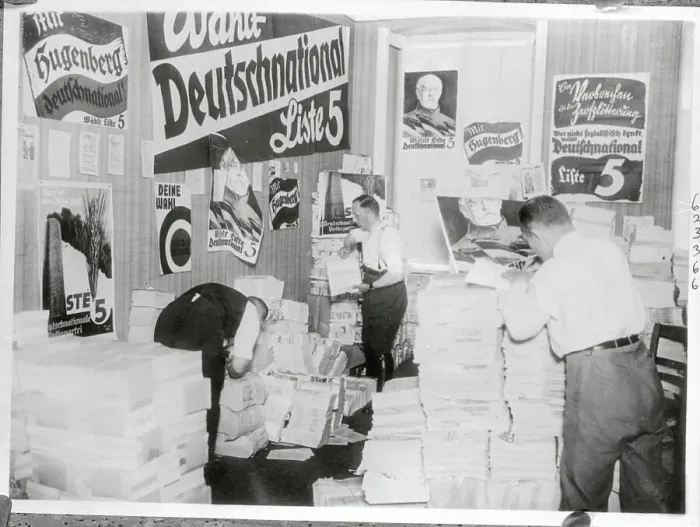 Framed Print : Two Men Going Through German Propaganda Materials Framed Print : Two Men Going Through German Propaganda Materials