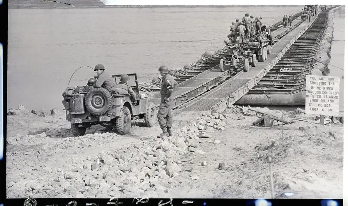 Framed Print : Men, Guns, Vehicles Crossing A Bridge Framed Print : Men, Guns, Vehicles Crossing A Bridge